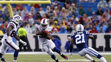 Aug 13, 2016; Orchard Park, NY, USA; Buffalo Bills running back Mike Gillislee (35) runs with the ball as Indianapolis Colts cornerback Vontae Davis (21) pursues and wide receiver Marquise Goodwin (88) looks to throw a block during the first quarter at Ralph Wilson Stadium. Mandatory Credit: Kevin Hoffman-USA TODAY Sports