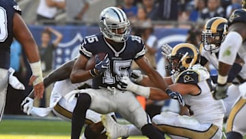 Aug 13, 2016; Los Angeles, CA, USA; Dallas Cowboys wide receiver Devin Street (15) is stopped by Los Angeles Rams inside linebacker Bryce Hager (54) after a complete pass in the first half of the game at the Los Angeles Memorial Coliseum. Mandatory Credit: Jayne Kamin-Oncea-USA TODAY Sports