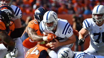 Sep 18, 2016; Denver, CO, USA; Indianapolis Colts quarterback Andrew Luck (12) is sacked by Denver Broncos outside linebacker Von Miller (58) and outside linebacker DeMarcus Ware (94) in the second half at Sports Authority Field at Mile High. Mandatory Credit: Ron Chenoy-USA TODAY Sports