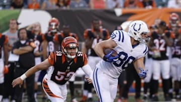 Sep 1, 2016; Cincinnati, OH, USA; Indianapolis Colts tight end Chase Coffman (80) runs against Cincinnati Bengals inside linebacker Nick Vigil (59) during the first quarter of a preseason NFL football game at Paul Brown Stadium. Mandatory Credit: David Kohl-USA TODAY Sports