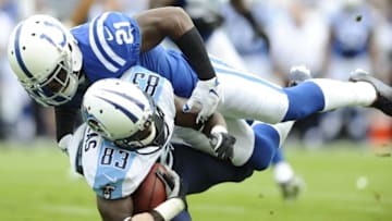 Sep 27, 2015; Nashville, TN, USA; Tennessee Titans receiver Harry Douglas (83) is tackled by Indianapolis Colts cornerback Vontae Davis (21) during the first half at Nissan Stadium. Mandatory Credit: Christopher Hanewinckel-USA TODAY Sports