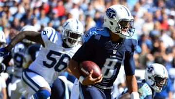 Oct 23, 2016; Nashville, TN, USA; Tennessee Titans quarterback Marcus Mariota (8) runs for a first down in the first half against the Tennessee Titans at Nissan Stadium. The Colts won 34-26. Mandatory Credit: Christopher Hanewinckel-USA TODAY Sports