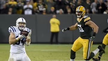 Nov 6, 2016; Green Bay, WI, USA; Indianapolis Colts tight end Jack Doyle (84) catches a pass against Green Bay Packers linebacker Kyler Fackrell (51) for a first down in the fourth quarter at Lambeau Field. Mandatory Credit: Benny Sieu-USA TODAY Sports