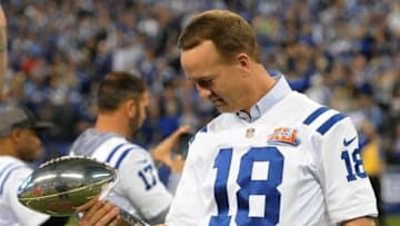 Nov 20, 2016; Indianapolis, IN, USA; Indianapolis Colts former quarterback Peyton Manning holds the Lombardi Trophy at halftime of a game against the Tennessee Titans to honor the 10th anniversary of the 2006 Super Bowl championship team at Lucas Oil Stadium. Mandatory Credit: Thomas J. Russo-USA TODAY Sports