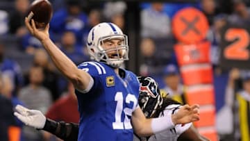 Dec 11, 2016; Indianapolis, IN, USA; Indianapolis Colts quarterback Andrew Luck (12) throws a pass against Houston Texans defensive end Jadevon Clowney (90) at Lucas Oil Stadium. Mandatory Credit: Thomas J. Russo-USA TODAY Sports