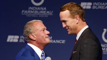 Mar 18, 2016; Indianapolis, IN, USA; Indianapolis Colts owner Jim Irsay greets Peyton Manning on stage during a press conference at Indiana Farm Bureau Football Center. Mandatory Credit: Brian Spurlock-USA TODAY Sports