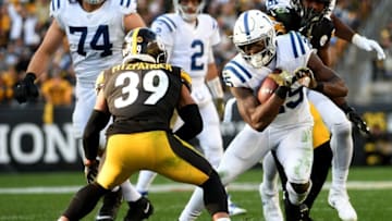 PITTSBURGH, PA - NOVEMBER 03: Marlon Mack #25 of the Indianapolis Colts carries the ball against Minkah Fitzpatrick #39 of the Pittsburgh Steelers in the second half during the game at Heinz Field on November 3, 2019 in Pittsburgh, Pennsylvania. (Photo by Justin Berl/Getty Images)