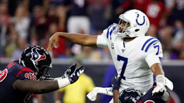 HOUSTON, TX - NOVEMBER 21: Jacoby Brissett #7 of the Indianapolis Colts gets a pass away under pressure by Brandon Dunn #92 of the Houston Texans and D.J. Reader #98 in the fourth quarter at NRG Stadium on November 21, 2019 in Houston, Texas. (Photo by Tim Warner/Getty Images)