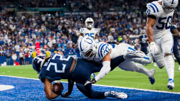 INDIANAPOLIS, IN - DECEMBER 01: Derrick Henry #22 of the Tennessee Titans carries the ball into the end zone for a touchdown during the third quarter against the Indianapolis Colts at Lucas Oil Stadium on December 1, 2019 in Indianapolis, Indiana. Tennessee defeats Indianapolis 31-17. (Photo by Brett Carlsen/Getty Images)