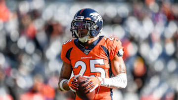 DENVER, CO - DECEMBER 29: Chris Harris Jr. #25 of the Denver Broncos walks on the field before a game against the Oakland Raiders at Empower Field at Mile High on December 29, 2019 in Denver, Colorado. (Photo by Dustin Bradford/Getty Images)