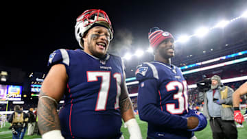 FOXBOROUGH, MASSACHUSETTS - DECEMBER 21: Danny Shelton #71 and Jason McCourty #30 of the New England Patriots leave the field after the Patriots defeated the Bills 24-17 in the game at Gillette Stadium on December 21, 2019 in Foxborough, Massachusetts. (Photo by Billie Weiss/Getty Images)