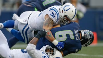 SEATTLE, WA - AUGUST 09: Quarterback Austin Davis #6 of the Seattle Seahawks is tackled by defensive end John Simon #51 and defensive end Denico Autry #95 of the Indianapolis Colts at CenturyLink Field on August 9, 2018 in Seattle, Washington. (Photo by Otto Greule Jr/Getty Images)
