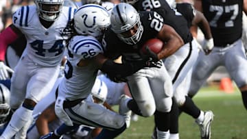 OAKLAND, CA - OCTOBER 28: Doug Martin #28 of the Oakland Raiders rushes against the Indianapolis Colts during their NFL game at Oakland-Alameda County Coliseum on October 28, 2018 in Oakland, California. (Photo by Robert Reiners/Getty Images)