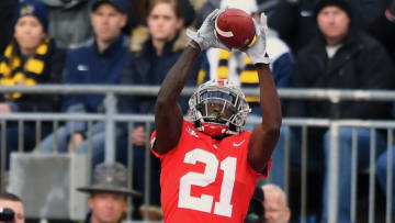 COLUMBUS, OH - NOVEMBER 24: Parris Campbell #21 of the Ohio State Buckeyes catches a 16-yard touchdown pass in the fourth quarter against the Michigan Wolverines at Ohio Stadium on November 24, 2018 in Columbus, Ohio. Ohio State defeated Michigan 62-39. (Photo by Jamie Sabau/Getty Images)