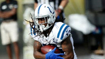 JACKSONVILLE, FL - DECEMBER 02: T.Y. Hilton #13 of the Indianapolis Colts is dragged down by D.J. Hayden #25 of the Jacksonville Jaguars during their game at TIAA Bank Field on December 2, 2018 in Jacksonville, Florida. (Photo by Joe Robbins/Getty Images)