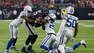 HOUSTON, TX - DECEMBER 09: Jordan Thomas #83 of the Houston Texans catches a pass for a first down tackled by Clayton Geathers #26 and Darius Leonard #53 of the Indianapolis Colts in the first quarter at NRG Stadium on December 9, 2018 in Houston, Texas. (Photo by Bob Levey/Getty Images)