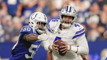 INDIANAPOLIS, IN - DECEMBER 16: Dak Prescott #4 of the Dallas Cowboys tries to escape from the hands of Anthony Walker #50 of the Indianapolis Colts at Lucas Oil Stadium on December 16, 2018 in Indianapolis, Indiana. (Photo by Michael Hickey/Getty Images)