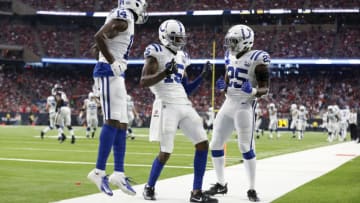 HOUSTON, TX - JANUARY 05: Dontrelle Inman #15 of the Indianapolis Colts celebrates with Marlon Mack #25 and Zach Pascal #14 after a touchdown reception in the second quarter against the Houston Texans during the Wild Card Round at NRG Stadium on January 5, 2019 in Houston, Texas. (Photo by Tim Warner/Getty Images)
