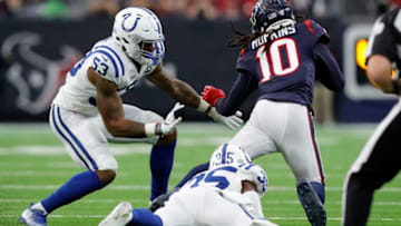 HOUSTON, TX - JANUARY 05: DeAndre Hopkins #10 of the Houston Texans is tackled by Pierre Desir #35 of the Indianapolis Colts and Darius Leonard #53 in the first half during the Wild Card Round at NRG Stadium on January 5, 2019 in Houston, Texas. (Photo by Tim Warner/Getty Images)