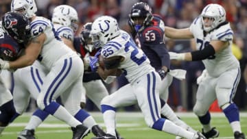 HOUSTON, TX - JANUARY 05: Marlon Mack #25 of the Indianapolis Colts carries the ball in the second quarter defended by Benardrick McKinney #55 of the Houston Texans and Duke Ejiofor #53 during the Wild Card Round at NRG Stadium on January 5, 2019 in Houston, Texas. (Photo by Tim Warner/Getty Images)