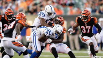 CINCINNATI, OHIO - AUGUST 29: Aca'Cedric Ware #38 of the Indianapolis Colts is tackled by the Cincinnati Bengals while running with the ball during the second quarter of a preseason game at Paul Brown Stadium on August 29, 2019 in Cincinnati, Ohio. (Photo by Silas Walker/Getty Images) (Photo by Silas Walker/Getty Images)