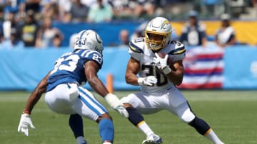 CARSON, CALIFORNIA - SEPTEMBER 08: Austin Ekeler #30 of the Los Angeles Chargers runs past the defense of Kenny Moore #23 of the Indianapolis Colts during the first half of a game at Dignity Health Sports Park on September 08, 2019 in Carson, California. (Photo by Sean M. Haffey/Getty Images)