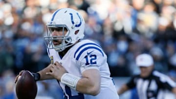 OAKLAND, CA - DECEMBER 24: Andrew Luck #12 of the Indianapolis Colts rushes for a 11-yard touchdown against the Oakland Raiders during their NFL game at Oakland Alameda Coliseum on December 24, 2016 in Oakland, California. (Photo by Brian Bahr/Getty Images)