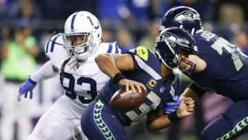 SEATTLE, WA - OCTOBER 1: Quarterback Russell Wilson #3 of the Seattle Seahawks rushes past Jabaal Sheard #93 of the Indianapolis Colts in the fourth quarter of the game at CenturyLink Field on October 1, 2017 in Seattle, Washington. (Photo by Otto Greule Jr/Getty Images)