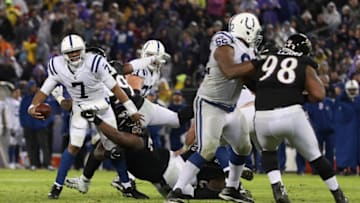 BALTIMORE, MD - DECEMBER 23: Quarterback Jacoby Brissett #7 of the Indianapolis Colts throws the ball as he is tackled in the fourth quarter against the Baltimore Ravens at M&T Bank Stadium on December 23, 2017 in Baltimore, Maryland. (Photo by Patrick Smith/Getty Images)