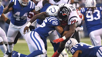 INDIANAPOLIS, IN - DECEMBER 31: Alfred Blue #28 of the Houston Texans is tackled by Clayton Geathers #26 of the Indianapolis Colts during the first half at Lucas Oil Stadium on December 31, 2017 in Indianapolis, Indiana. (Photo by Stacy Revere/Getty Images)