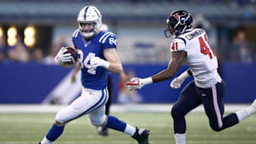 INDIANAPOLIS, IN - DECEMBER 31: Jack Doyle #84 of the Indianapolis Colts runs with the ball chased by Zach Cunningham #41 of the Houston Texans during the first half at Lucas Oil Stadium on December 31, 2017 in Indianapolis, Indiana. (Photo by Andy Lyons/Getty Images)