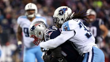 FOXBOROUGH, MA - JANUARY 13: Rob Gronkowski #87 of the New England Patriots is tackled after a catch by Johnathan Cyprien #37 of the Tennessee Titans in the fourth quarter of the AFC Divisional Playoff game at Gillette Stadium on January 13, 2018 in Foxborough, Massachusetts. (Photo by Adam Glanzman/Getty Images)