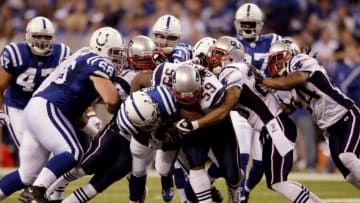 INDIANAPOLIS - NOVEMBER 15: Chad Simpson #35 of the Indianapolis Colts holds on to the ball against Gary Guyton #59 of the New England Patriots during the game at Lucas Oil Stadium on November 15, 2009 in Indianapolis, Indiana. (Photo by Andy Lyons/Getty Images)