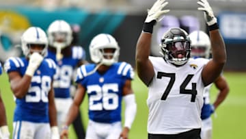 JACKSONVILLE, FLORIDA - SEPTEMBER 13: Cam Robinson #74 of the Jacksonville Jaguars raises his hands for crowd support after the Indianapolis Colts turned over on downs in the fourth quarter at TIAA Bank Field on September 13, 2020 in Jacksonville, Florida. (Photo by Julio Aguilar/Getty Images)