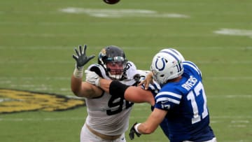 JACKSONVILLE, FLORIDA - SEPTEMBER 13: Taven Bryan #90 of the Jacksonville Jaguars pressures Philip Rivers #17 of the Indianapolis Colts during the game at TIAA Bank Field on September 13, 2020 in Jacksonville, Florida. (Photo by Sam Greenwood/Getty Images)