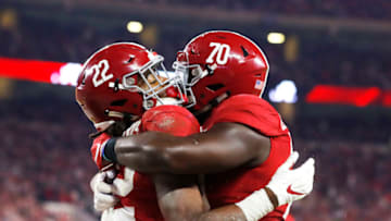 TUSCALOOSA, ALABAMA - NOVEMBER 09: Najee Harris #22 of the Alabama Crimson Tide celebrates with Alex Leatherwood #70 after catching a 15-yard touchdown pass against the LSU Tigers during the third quarter in the game at Bryant-Denny Stadium on November 09, 2019 in Tuscaloosa, Alabama. (Photo by Kevin C. Cox/Getty Images)