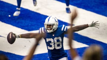 INDIANAPOLIS, IN - SEPTEMBER 27: T.J. Carrie #38 of the Indianapolis Colts reacts after running an interception back for a touchdown during the third quarter of the game against the New York Jets at Lucas Oil Stadium on September 27, 2020 in Indianapolis, Indiana. (Photo by Bobby Ellis/Getty Images)