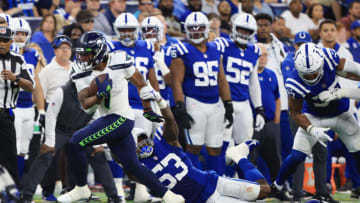 INDIANAPOLIS, INDIANA - SEPTEMBER 12: D'Wayne Eskridge #1 of the Seattle Seahawks breaks a tackle from Darius Leonard #53 of the Indianapolis Colts at Lucas Oil Stadium on September 12, 2021 in Indianapolis, Indiana. (Photo by Justin Casterline/Getty Images)