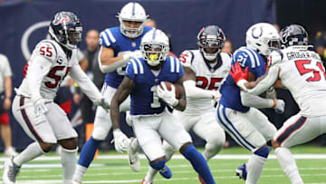 HOUSTON, TEXAS - SEPTEMBER 11: Indianapolis Colts wide receiver Parris Campbell #1 runs past Houston Texans defensive end Jerry Hughes #55 at NRG Stadium on September 11, 2022 in Houston, Texas. (Photo by Bob Levey/Getty Images)