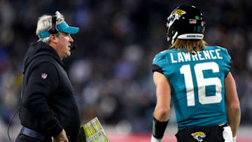 JACKSONVILLE, FLORIDA - JANUARY 14: Head coach Doug Pederson and Trevor Lawrence #16 of the Jacksonville Jaguars talk on the field during the second half of the game against the Los Angeles Chargers in the AFC Wild Card playoff game at TIAA Bank Field on January 14, 2023 in Jacksonville, Florida. (Photo by Courtney Culbreath/Getty Images)