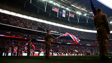 LONDON, ENGLAND - OCTOBER 02: Members of the armed forces hold the national flags of the United Kingdom and the United States before the start of the during the NFL game between Indianapolis Colts and Jacksonville Jaguars at Wembley Stadium on October 2, 2016 in London, England. (Photo by Dan Istitene/Getty Images)