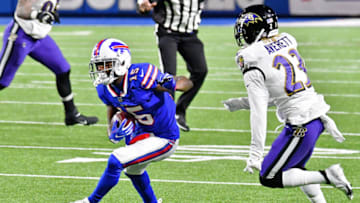 Jan 16, 2021; Orchard Park, New York, USA; Buffalo Bills wide receiver John Brown (15) runs with the ball as Baltimore Ravens cornerback Anthony Averett (23) closes in during the second half of an AFC Divisional Round playoff game at Bills Stadium. The Buffalo Bills won 17-3. Mandatory Credit: Mark Konezny-USA TODAY Sports