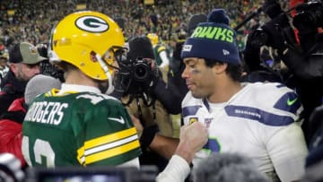 Green Bay Packers quarterback Aaron Rodgers (12) meets with Seattle Seahawks quarterback Russell Wilson (3) following their NFC divisional round playoff football game on Sunday, January 12, 2020, at Lambeau Field in Green Bay, Wis. Green Bay defeated Seattle 28-23.Wm. Glasheen/USA TODAY NETWORK-WisconsinApc Packers Vs Seahawks 2065 011220 Wag