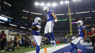 Dec 4, 2022; Arlington, Texas, USA; Indianapolis Colts wide receiver Ashton Dulin (16) and wide receiver Michael Pittman Jr. (11) celebrate a touchdown pass in the first quarter against the Dallas Cowboys at AT&T Stadium. Mandatory Credit: Tim Heitman-USA TODAY Sports