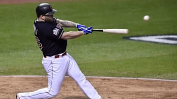 Nov 1, 2016; Cleveland, OH, USA; Cleveland Indians first baseman Mike Napoli hits a RBI single against the Chicago Cubs in the fourth inning in game six of the 2016 World Series at Progressive Field. Mandatory Credit: David Richard-USA TODAY Sports