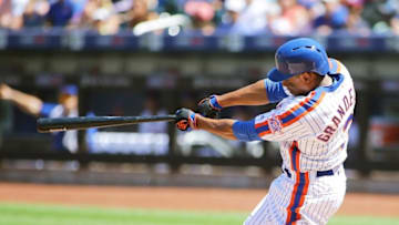 Aug 28, 2016; New York City, NY, USA; New York Mets left fielder Curtis Granderson (3) hits an RBI sacrifice fly against the Philadelphia Phillies during the first inning at Citi Field. Mandatory Credit: Andy Marlin-USA TODAY Sports