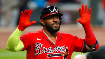 ATLANTA, GA - AUGUST 21: Marcell Ozuna #20 of the Atlanta Braves reacts after he hits a three run home run in the fifth inning of an MLB game against the Philadelphia Phillies at Truist Park on August 21, 2020 in Atlanta, Georgia. (Photo by Todd Kirkland/Getty Images)