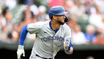 BALTIMORE, MARYLAND - SEPTEMBER 05: Lourdes Gurriel Jr. #13 of the Toronto Blue Jays runs to first base against the Baltimore Orioles at Oriole Park at Camden Yards during game one of a double header on September 05, 2022 in Baltimore, Maryland. (Photo by G Fiume/Getty Images)