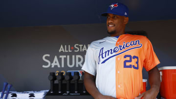 LOS ANGELES, CALIFORNIA - JULY 16: Yosver Zulueta #23 of the American League gets ready in the dugout before the SiriusXM All-Star Futures Game at Dodger Stadium on July 16, 2022 in Los Angeles, California. (Photo by Ronald Martinez/Getty Images)