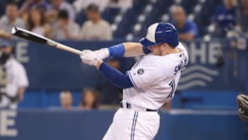 TORONTO, ON - SEPTEMBER 5: Justin Smoak #14 of the Toronto Blue Jays hits an RBI single in the first inning during MLB game action against the Tampa Bay Rays at Rogers Centre on September 5, 2018 in Toronto, Canada. (Photo by Tom Szczerbowski/Getty Images)